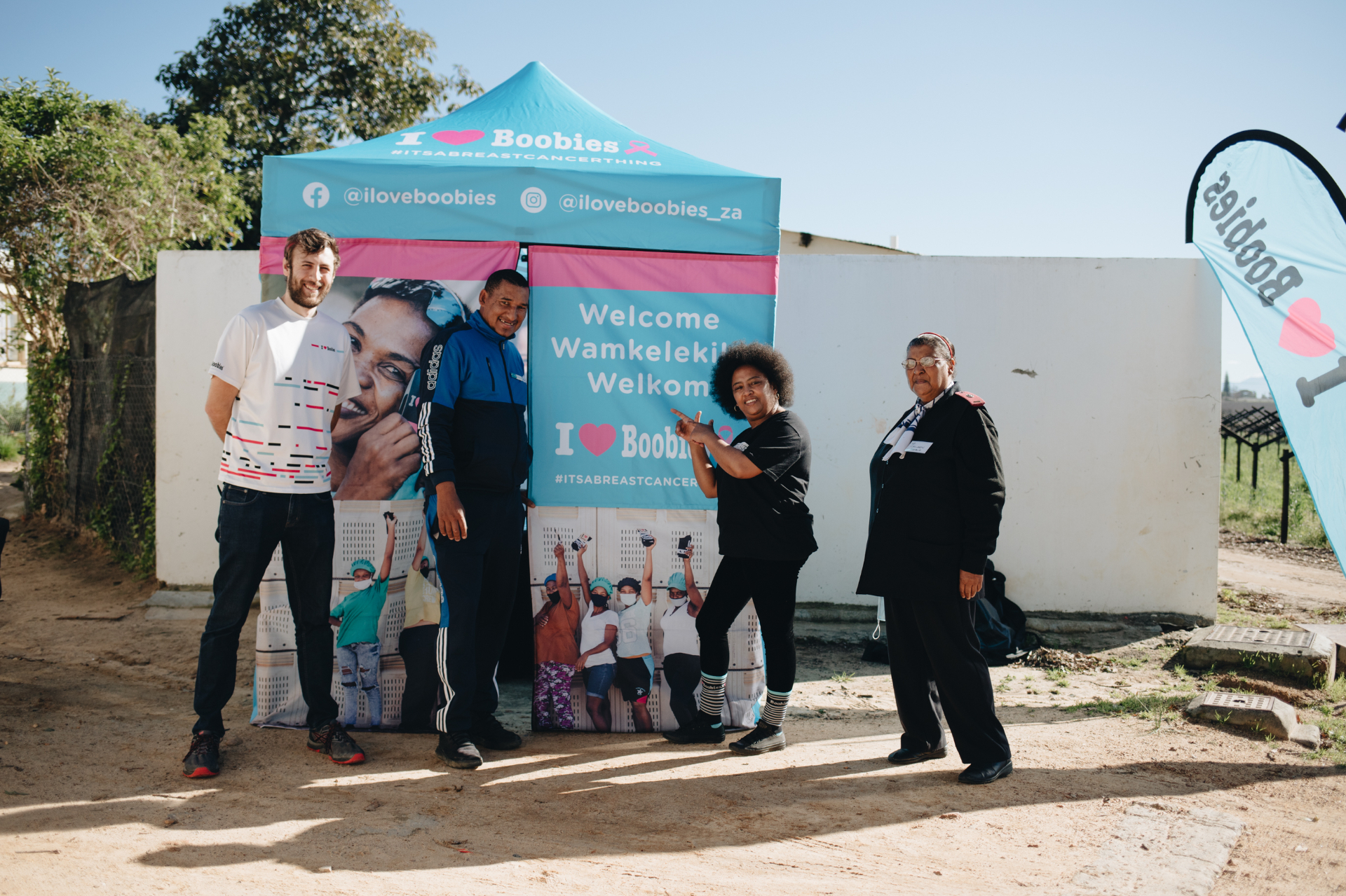 Team welcoming attendees at the ILoveBoobies tent