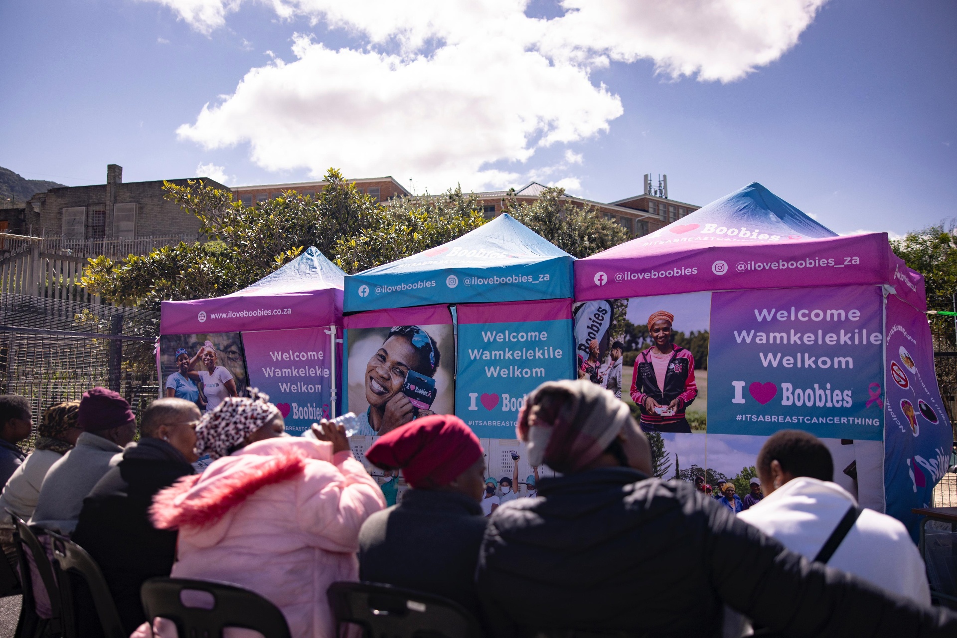 Community gathered at ILoveBoobies welcome tents